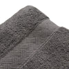 Close-up of a textured gray bath towel with a herringbone pattern.
